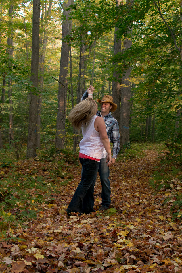 dance in the woods during engagement session